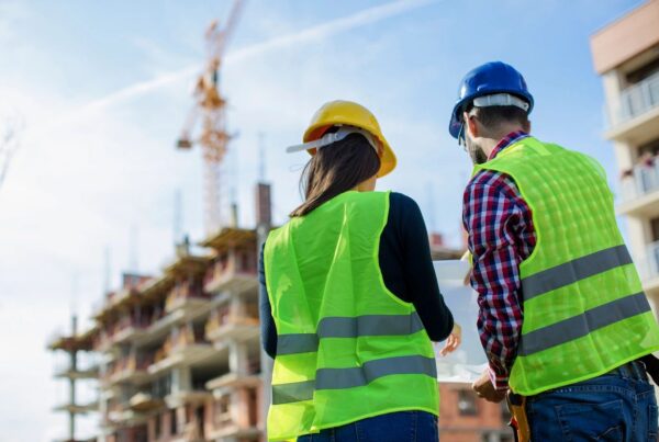 Contractor reviewing job costing and project expenses to track profitability in Canada