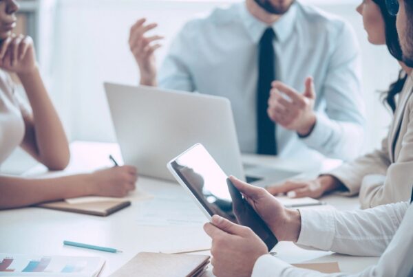 Contractor reviewing payroll mistakes and tax documents in Canada